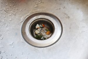 close up on dirty kitchen sink drain